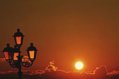 Low angle view of street light at sunset