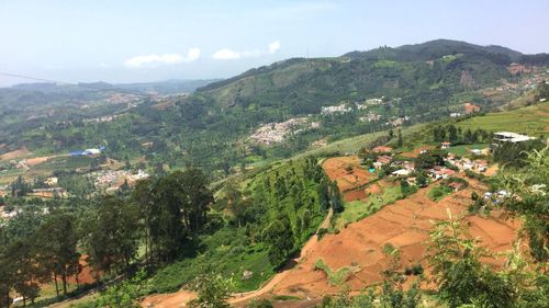 Scenic view of agricultural field and mountains against sky