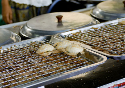 High angle view of meat on barbecue grill