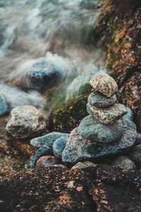 Close-up of pebbles in water