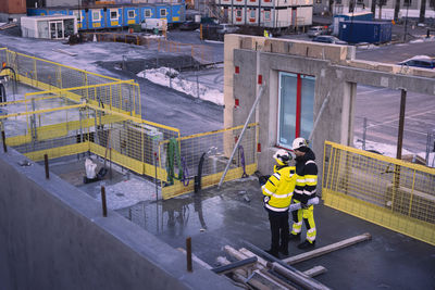 Two engineers working at construction site