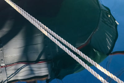 Detailed close up detail of ropes and cordage in the rigging of an old wooden vintage sailboat.