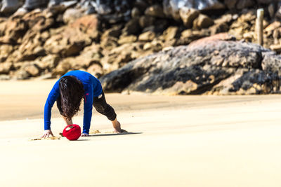 Woman with umbrella on beach