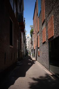 Narrow alley amidst buildings in city