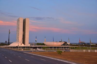 View of airport runway against sky during sunset