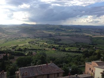 High angle view of house against cloudy sky