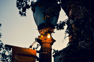 Low angle view of street light against sky