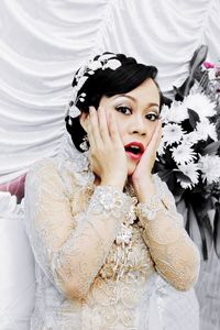 Portrait of shocked bride during wedding ceremony