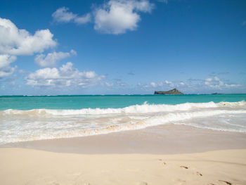 Scenic view of beach against sky