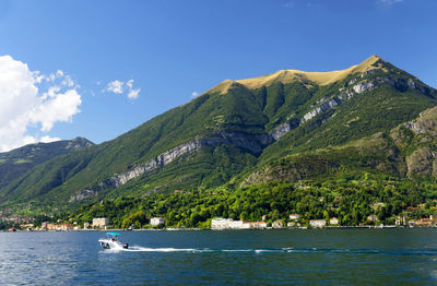 Calm lake against lush foliage