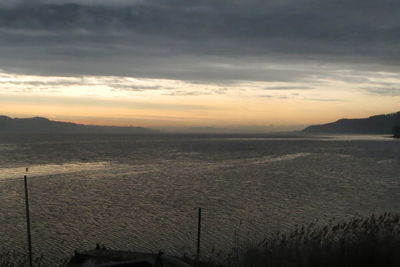 Scenic view of calm sea at dusk