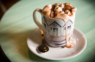 Close-up of coffee cup on table