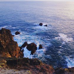 High angle view of rock formations in sea