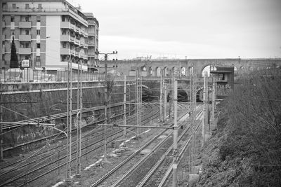 High angle view of railroad tracks in city against sky