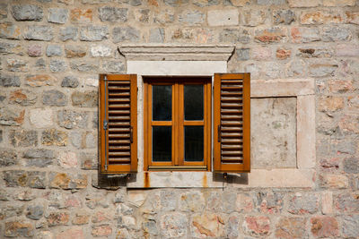 Close-up of window on brick wall