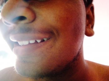 Close-up portrait of smiling young man