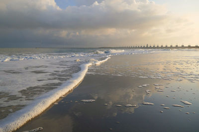 Scenic view of beach against sky