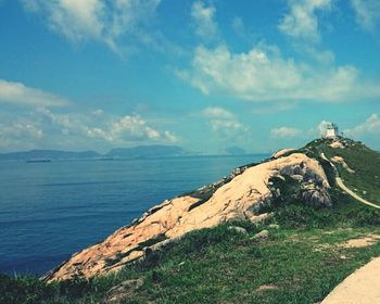 Scenic view of landscape against cloudy sky