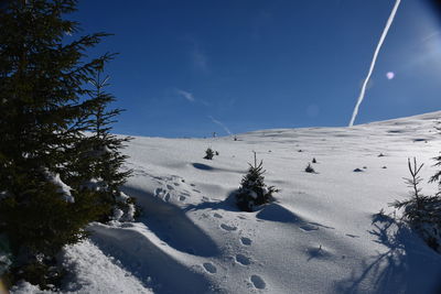 Scenic view of snow covered landscape against sky