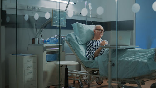 Senior patient talking on video call at hospital