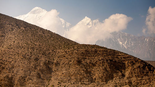 Low angle view of majestic mountains against sky