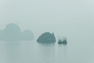 Scenic view of bay against clear sky