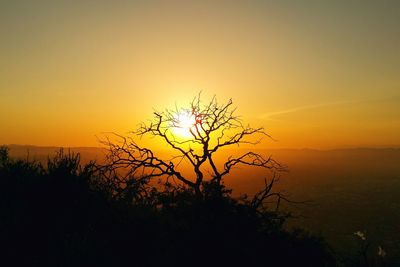Scenic view of landscape against sky at sunset