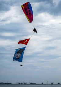 Low angle view of kite flying against sky