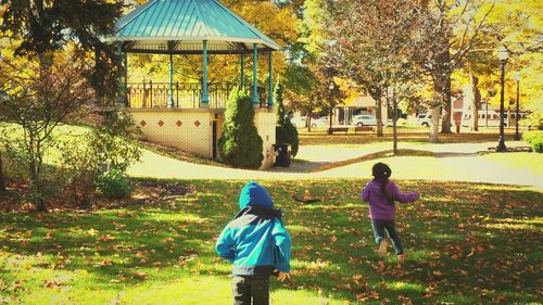 Boy walking on grass