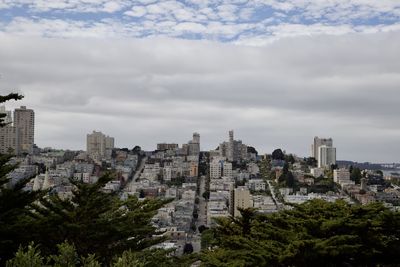 Buildings in city against sky