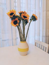 Sunflowers vase on white table