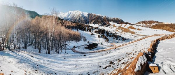 Scenic view of snow covered mountains against sky