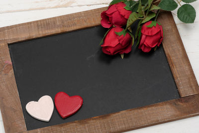 High angle view of red rose on table