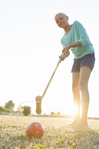 Girl playing croquet, skanor, skane, sweden