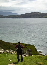 Rear view of man standing on mountain