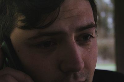 Close-up portrait of man crying