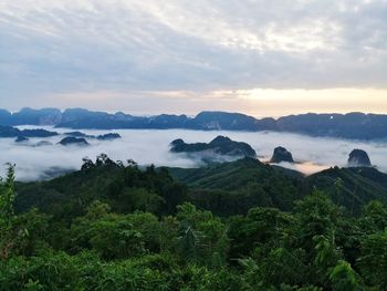 Scenic view of mountains against sky at sunset