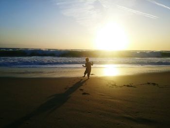 Scenic view of sea at sunset