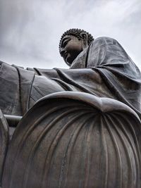 Low angle view of statue against sky