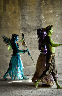 Women dancing on wall