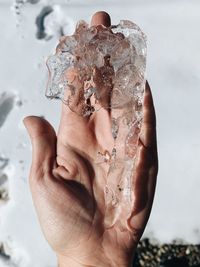 Close-up of hand holding ice cream