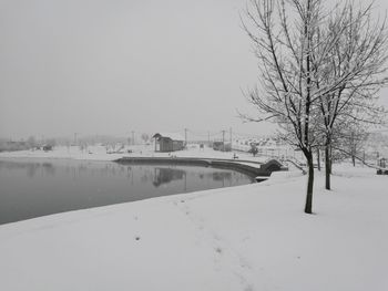 Scenic view of snow covered landscape against clear sky