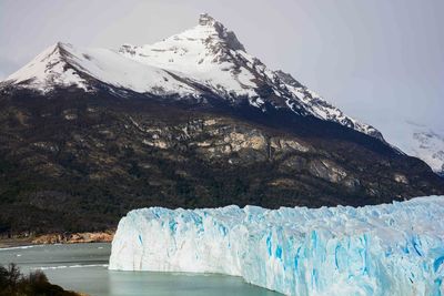 Moreno glacier with snowcapped mountain in background