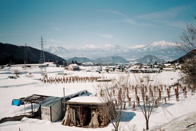 Houses on snow covered landscape