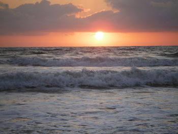 Scenic view of sea at sunset