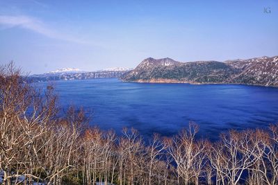 Scenic view of sea against blue sky