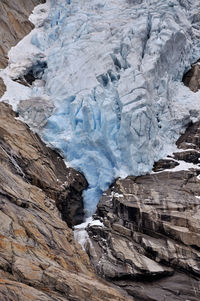 Scenic view of snow covered rocks