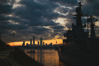 Panoramic view of buildings against cloudy sky