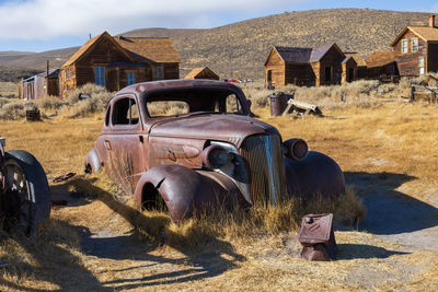 Abandoned car on field