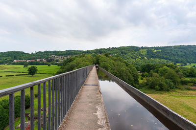 Scenic view of bridge over landscape against sky